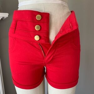 2 pairs of white and red size 4 refuge shorts